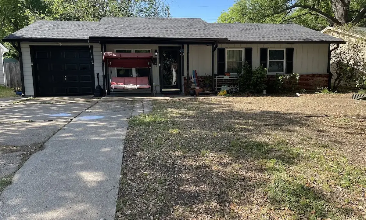 Wind Damage Roof Repair crew at work on a residential roof in Holly Hill